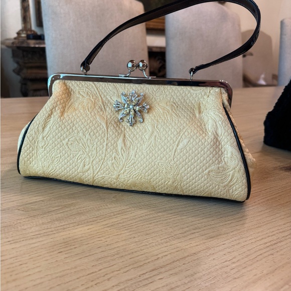 Glenda Gies Handbags - Chic  soft yellow  lady  Bag with black patent handle and trim. Silver Detailin.